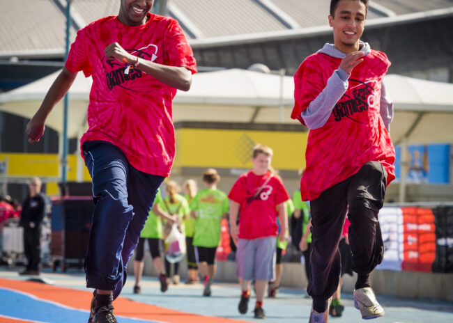 Two young men run on a tracing track