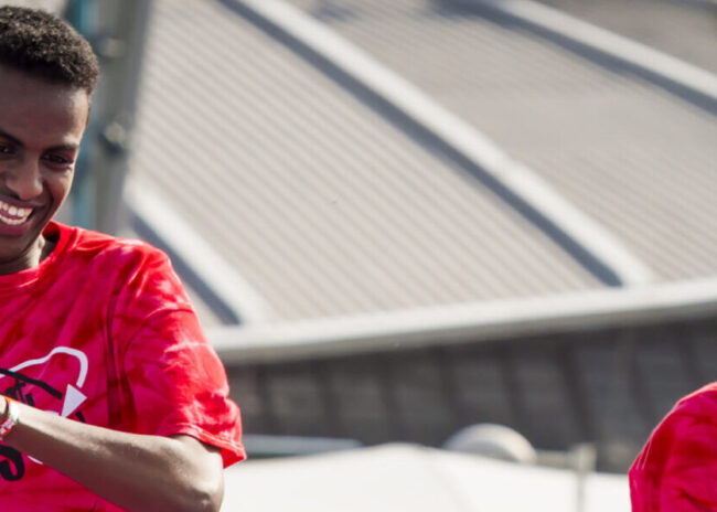 Two young men run on a tracing track